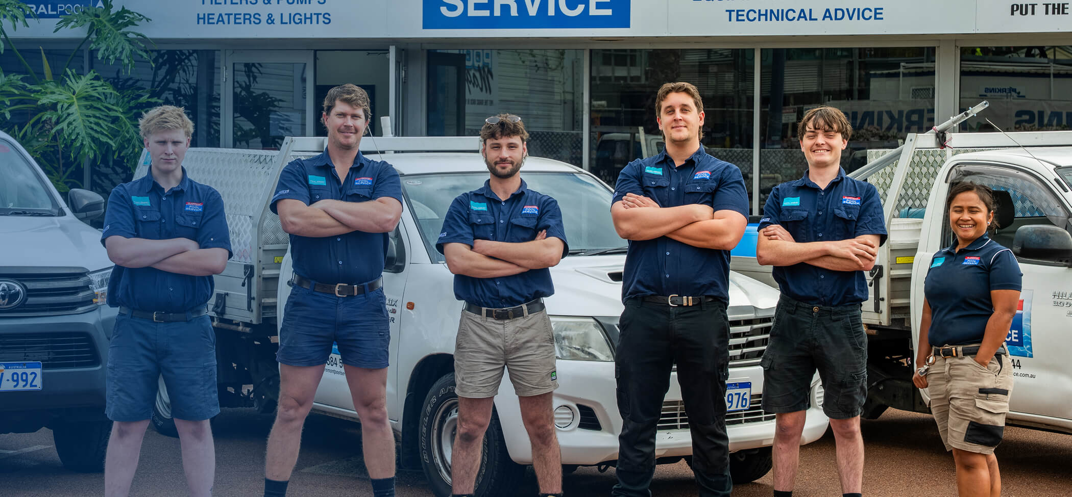 The Claremont Pool Service team standing in front of their service utes